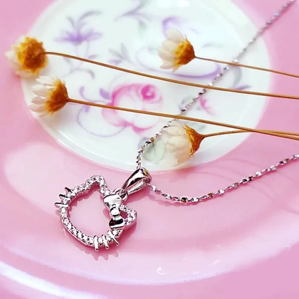 Still Kimora Lee, wearing Hello Kitty diamond necklace from her 